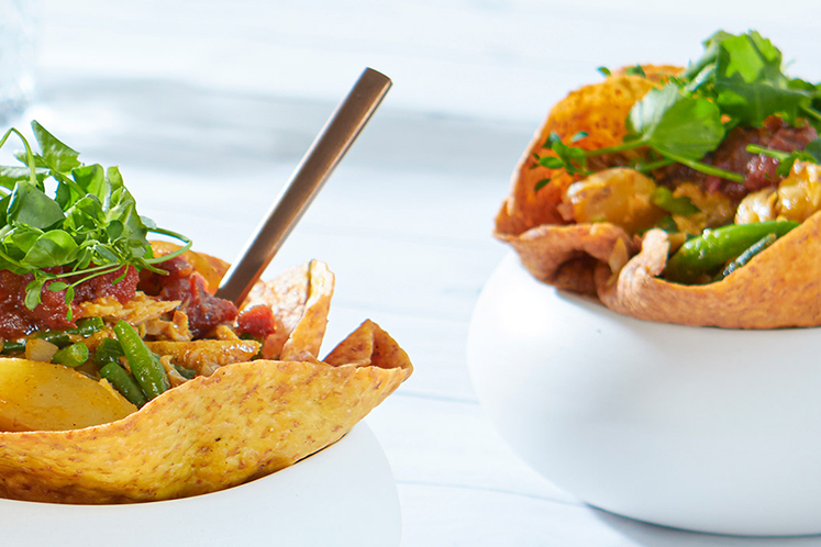 Rotibowl met kip, kousenband en aardappelpartjes